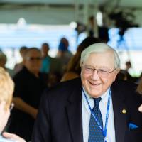 Don Lubbers speaking with guests at the Jamie Hosford Football Center dedication.